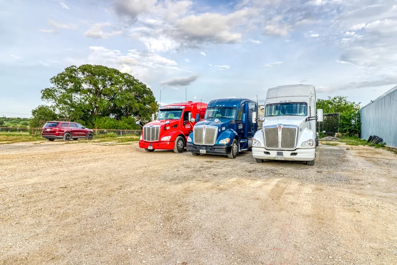 Secure gated truck parking facility entrance with perimeter fencing and 24 hour surveillance in Trimble Missouri